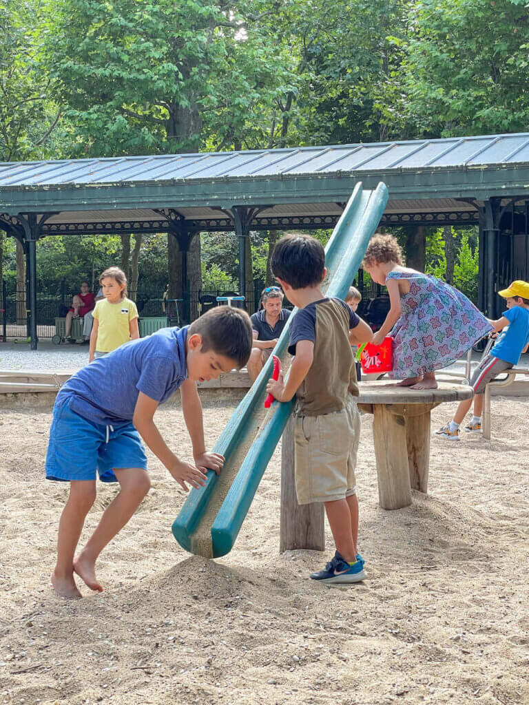 Image of kids playing in a sandpit at a playground at Jardin du Luxembourg in Paris