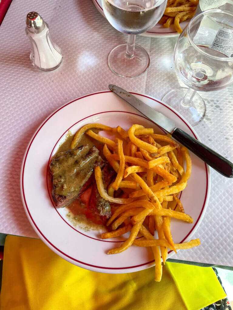 Image of a plate of steak and fries at a Paris restaurant