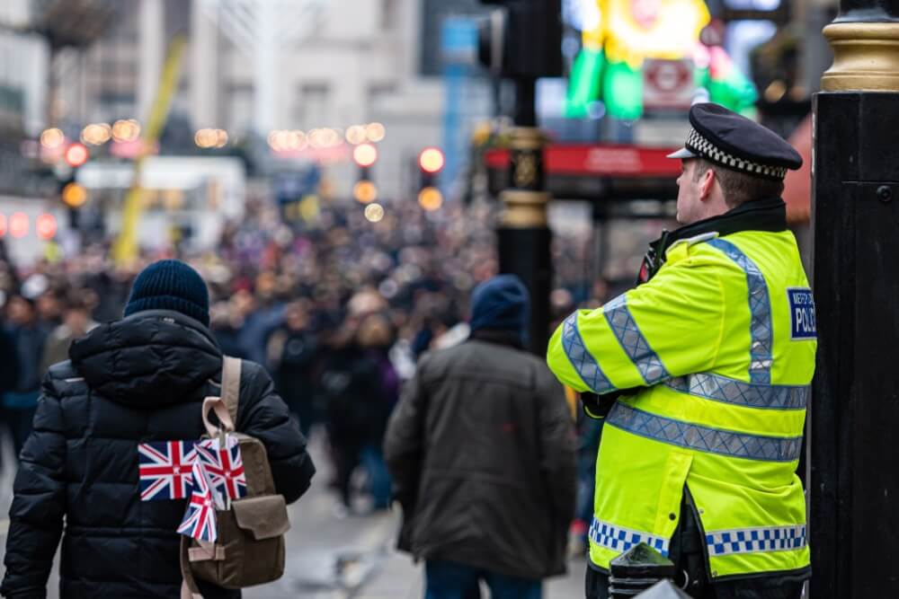 Image of a Metropolitan police officer in a yellow jacket in London