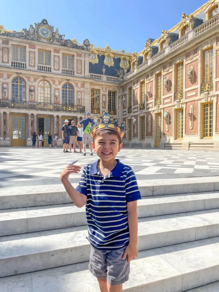 Image of a boy wearing a crown at Versailles