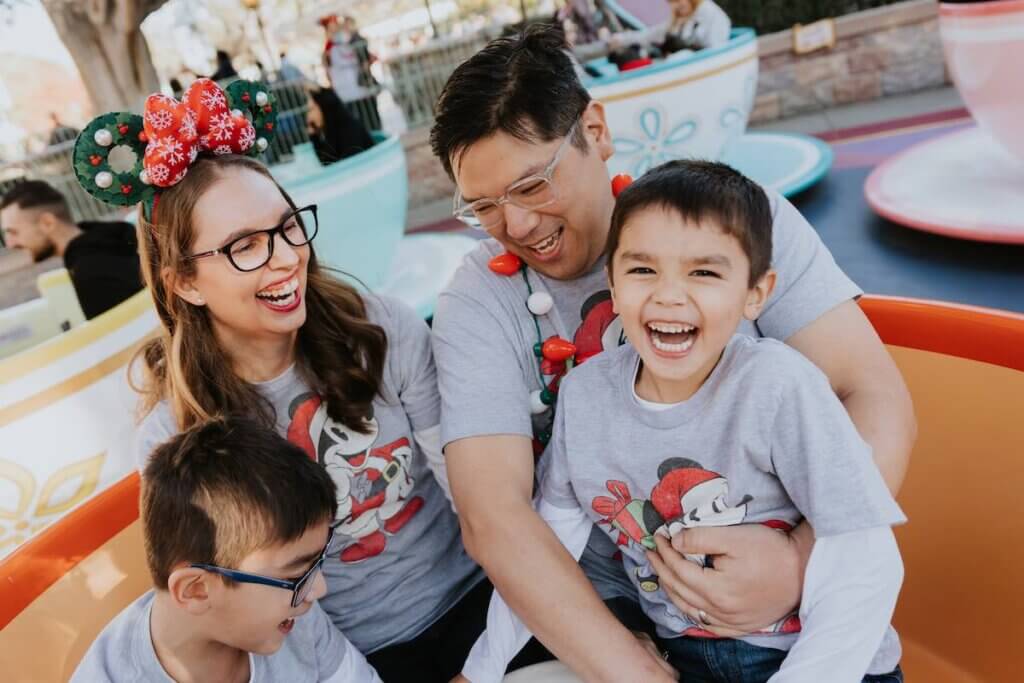 Image of a family wearing matching Mickey Christmas shirts at Disneyland