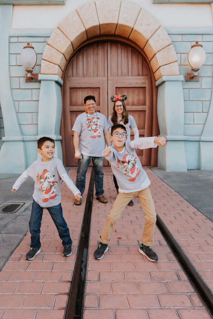 Image of kids dancing in front of the parents at Disneyland