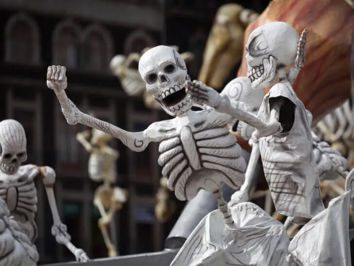Check out these amazing Halloween traditions from around the world suggested by top family travel blog Marcie in Mommyland. Image of skeletons