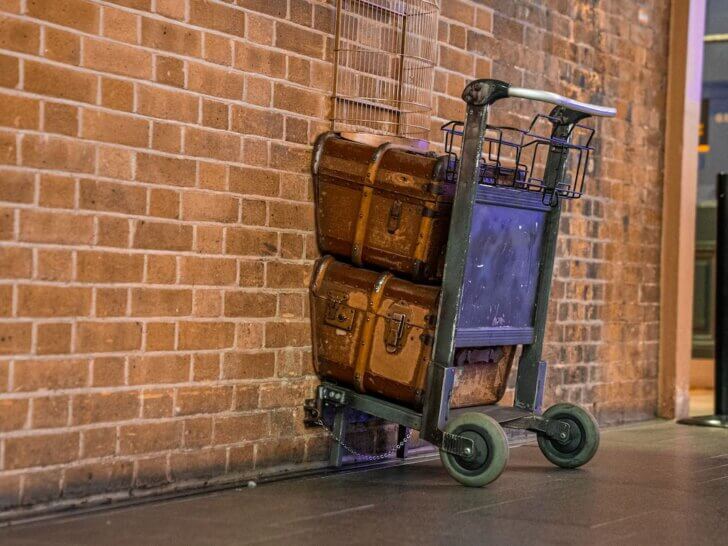Check out the most magical Harry Potter destinations recommended by top family travel blog Marcie in Mommyland! Image of a Hogwarts cart at King's Cross Station in London