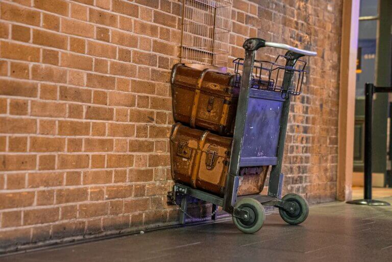Check out the most magical Harry Potter destinations recommended by top family travel blog Marcie in Mommyland! Image of a Hogwarts cart at King's Cross Station in London