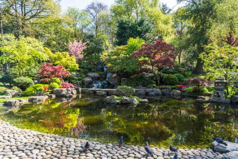Check out this list of the best hidden gems in London by top family travel blog Marcie in Mommyland. Image of Holland Park