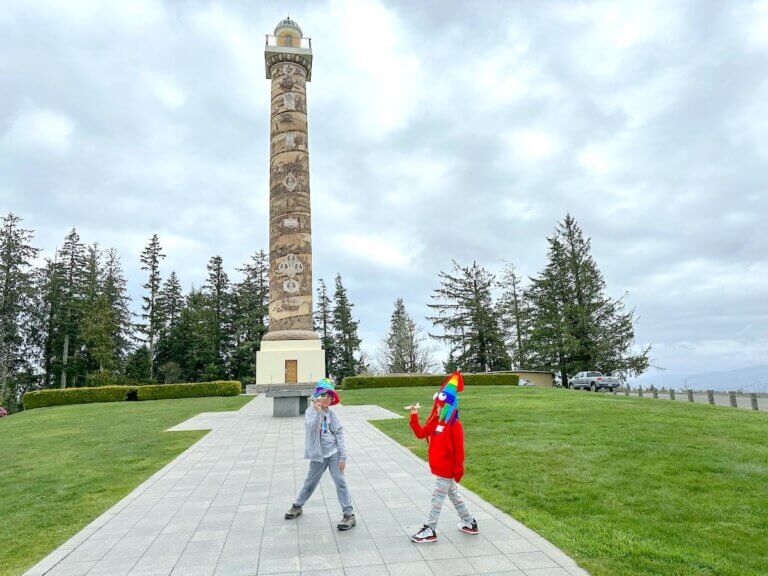 Check out the best things to do in Astoria Oregon with kids recommended by top family travel blog Marcie in Mommyland. Image of two boys at the Astoria Column