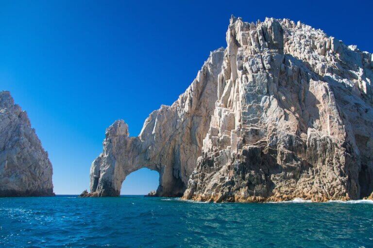 Find out the best things to do in Cabo San Lucas with family according to top family travel blog Marcie in Mommyland. Image of The Distinctive Arch at Cabo San Lucas, Mexico in the Sea of Cortez