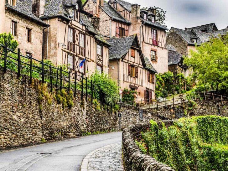 Find out the best hidden gems in France according to top family travel blog Marcie in Mommyland. Image of Located on the route of Santiago de Compostela in France we find this medieval village Conques out of a fairy book in the region of occitania