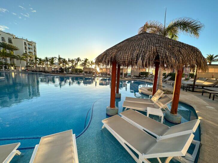 Check out this honest Hyatt Ziva Los Cabos review by top family travel blog Marcie in Mommyland. Image of an all-inclusive Mexico resort pool