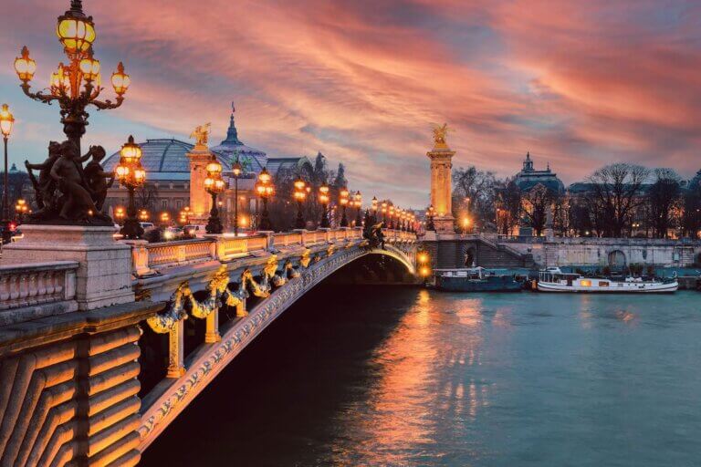 Find out the best things to do in Paris at night recommended by top family travel blog Marcie in Mommyland. Image of Pont Alexandre III (Alexander the third bridge) over river Seine in Paris