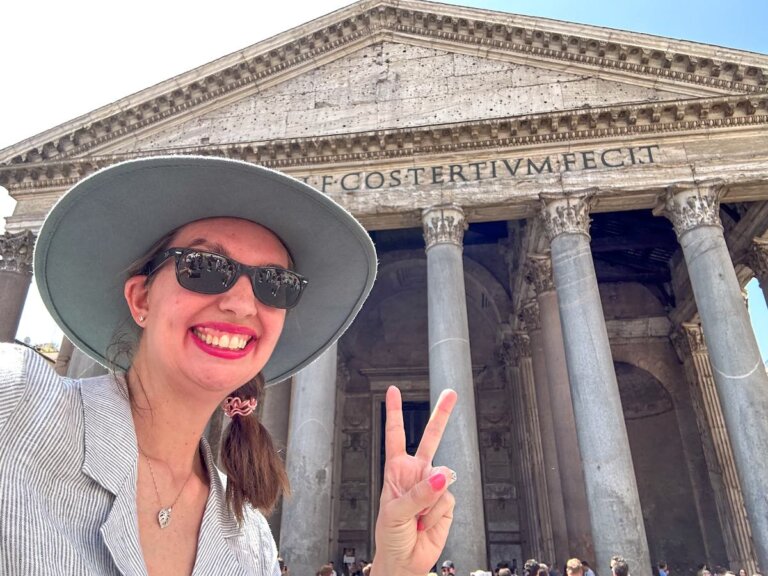 Find out the best Rome travel tips by top family travel blog Marcie in Mommyland. Image of a woman taking a selfie at the Pantheon
