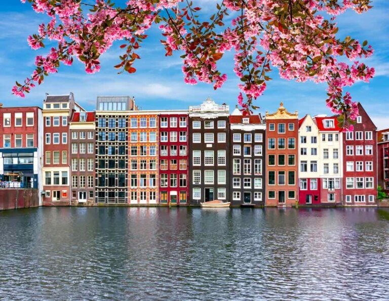 Find out the best cities to visit in Europe in Spring recommended by top travel blog Marcie in Mommyland. Image of Amsterdam in Spring