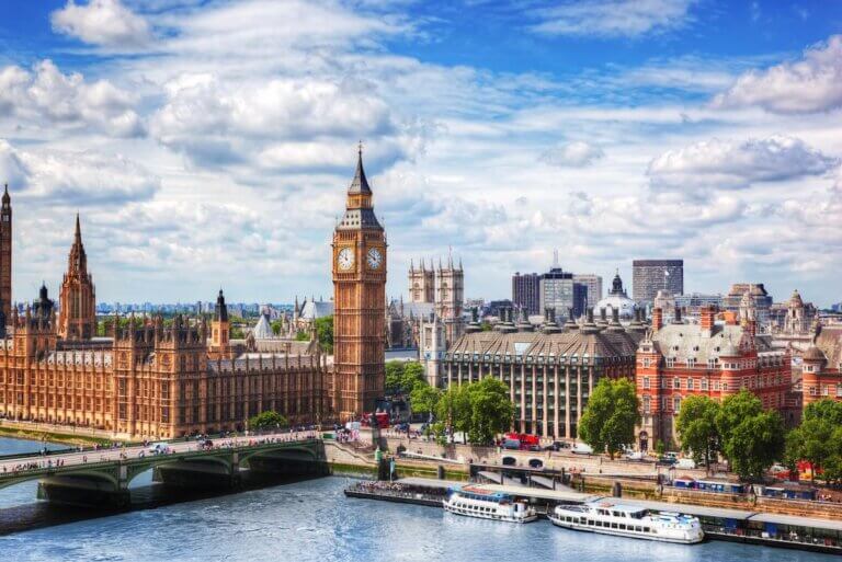 Find out the best family-friendly hotels in London England recommended by top family travel blog Marcie in Mommyland. Image of Big Ben, Westminster Bridge on River Thames in London, the UK. English symbol. Lovely puffy clouds, sunny day