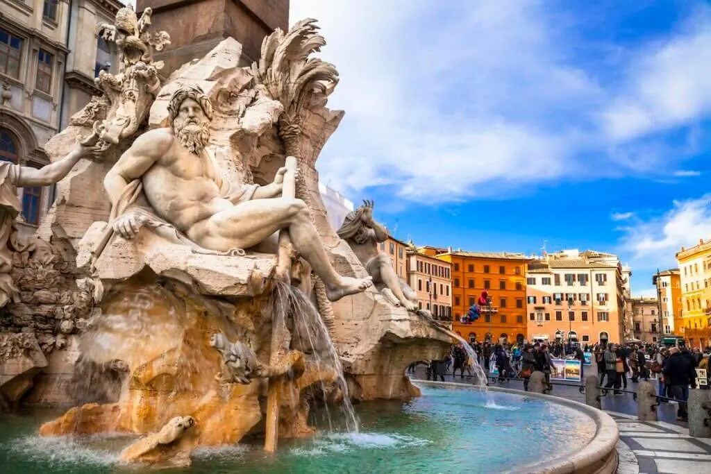 Find out the best Rome travel tips by top family travel blog Marcie in Mommyland. Image of the Trevi Fountain in Rome Italy