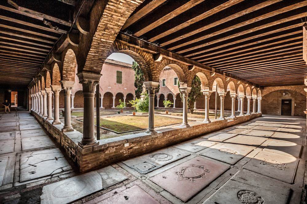 Inner Courtyard of the Church of San Francesco della Vigna Venice with grave stones of former monks, Venice, Italy