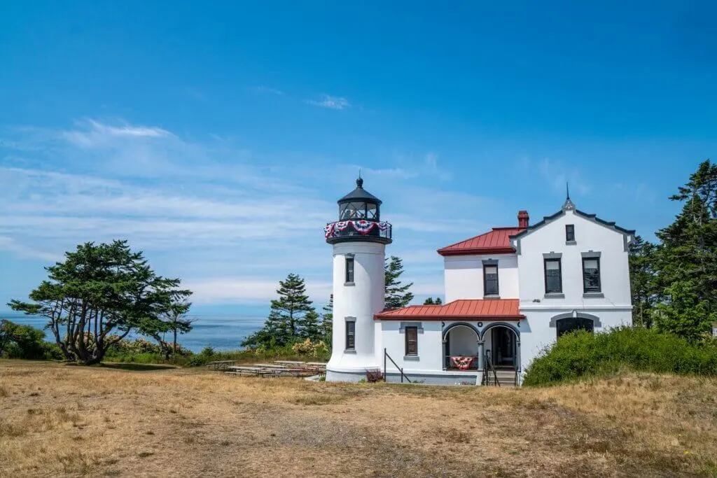 Admiralty Head Lighthouse on Whidbey Island overlooking the Puget Sound of Washington State. Light house is decorated for the Fourth of July