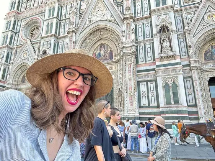 Find out the best Florence travel tips by top family travel blog Marcie in Mommyland. Image of a woman in front of a church in Florence Italy