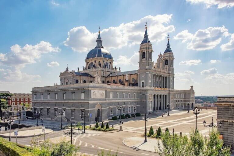 Find out the best Madrid travel tips for first-timers recommended by top family travel blog Marcie in Mommyland. Image of Almudena Cathedral in Madrid, Spain