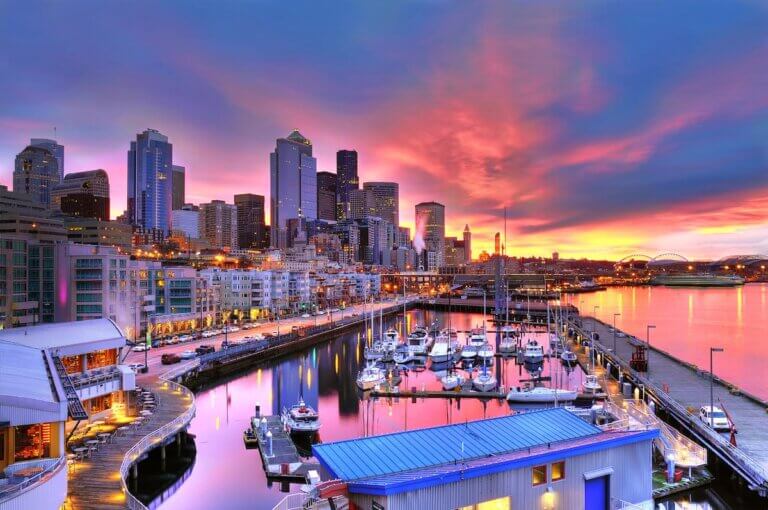 Check out this list of the best hotels in Seattle for families recommended by Seattle family travel blog Marcie in Mommyland. Image of the Famous Seattle skyline dazzling under a beautiful dawn sky across pier-66 waterfront