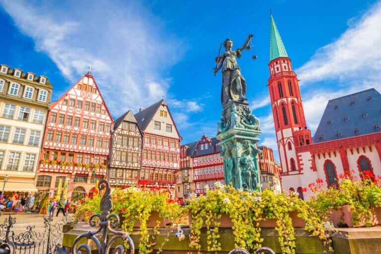 Check out the best Germany travel tips by top travel blog Marcie in Mommyland. Image of Frankfurt, Germany Old Town skyline.