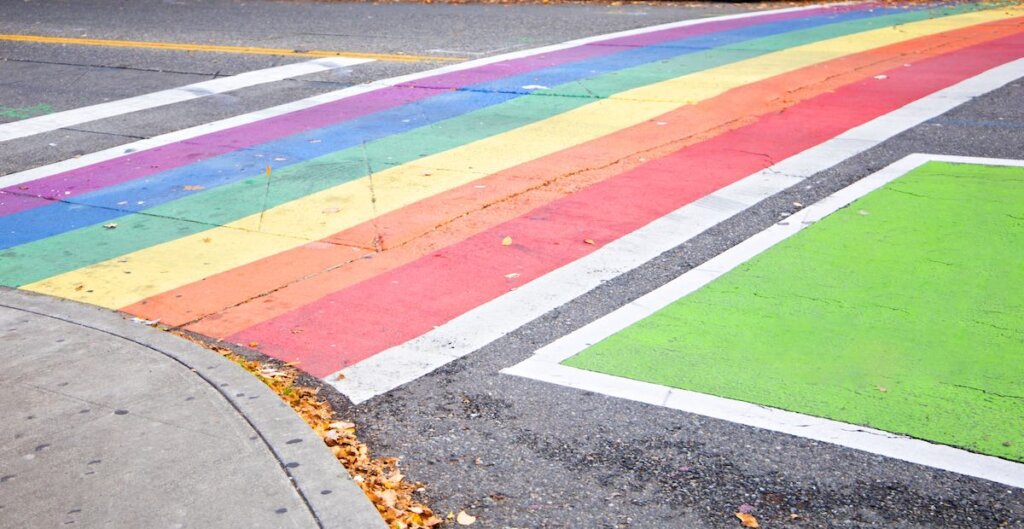 The crosswalk in downtown Seattle Washington painted with a rainbow.