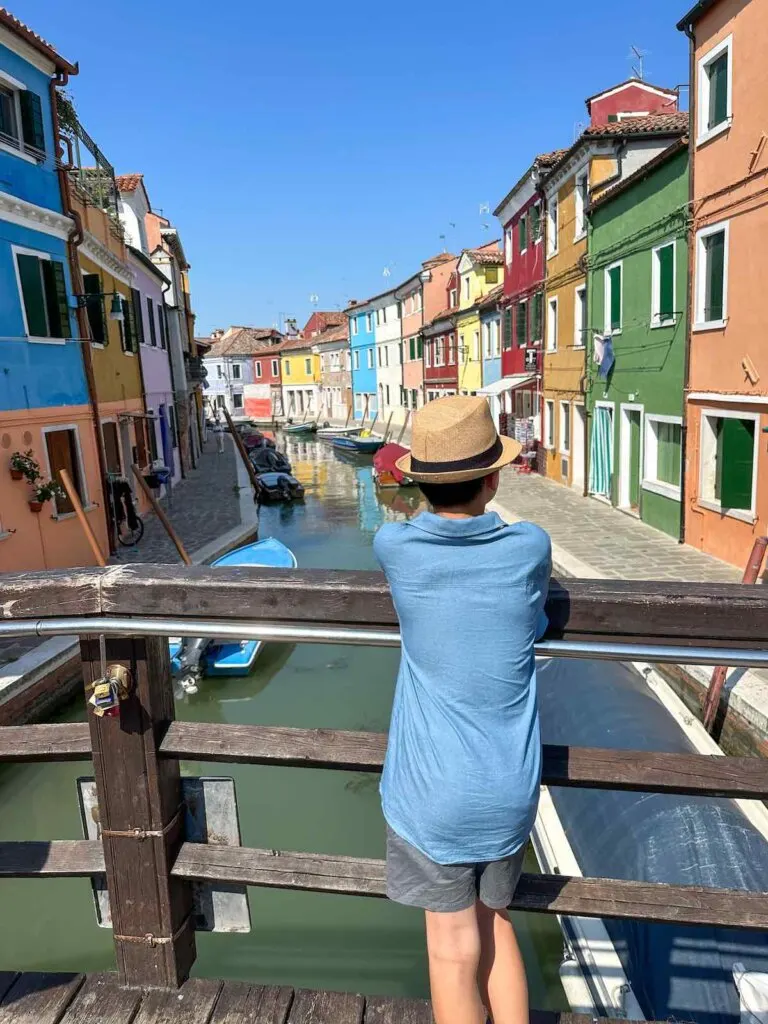 Image of a boy on a bridge in Burano near Venice