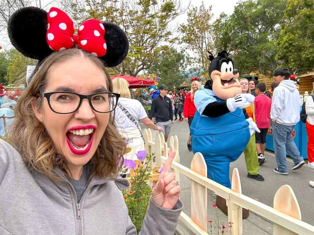 Image of a woman pointing at Pete in Disneyland Toontown.