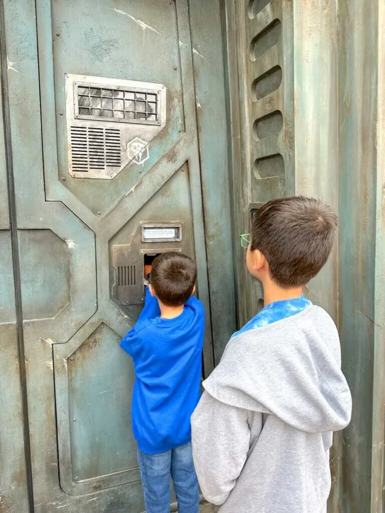 Image of two boys bounty hunting in Star Wars Galaxy's Edge at Disneyland