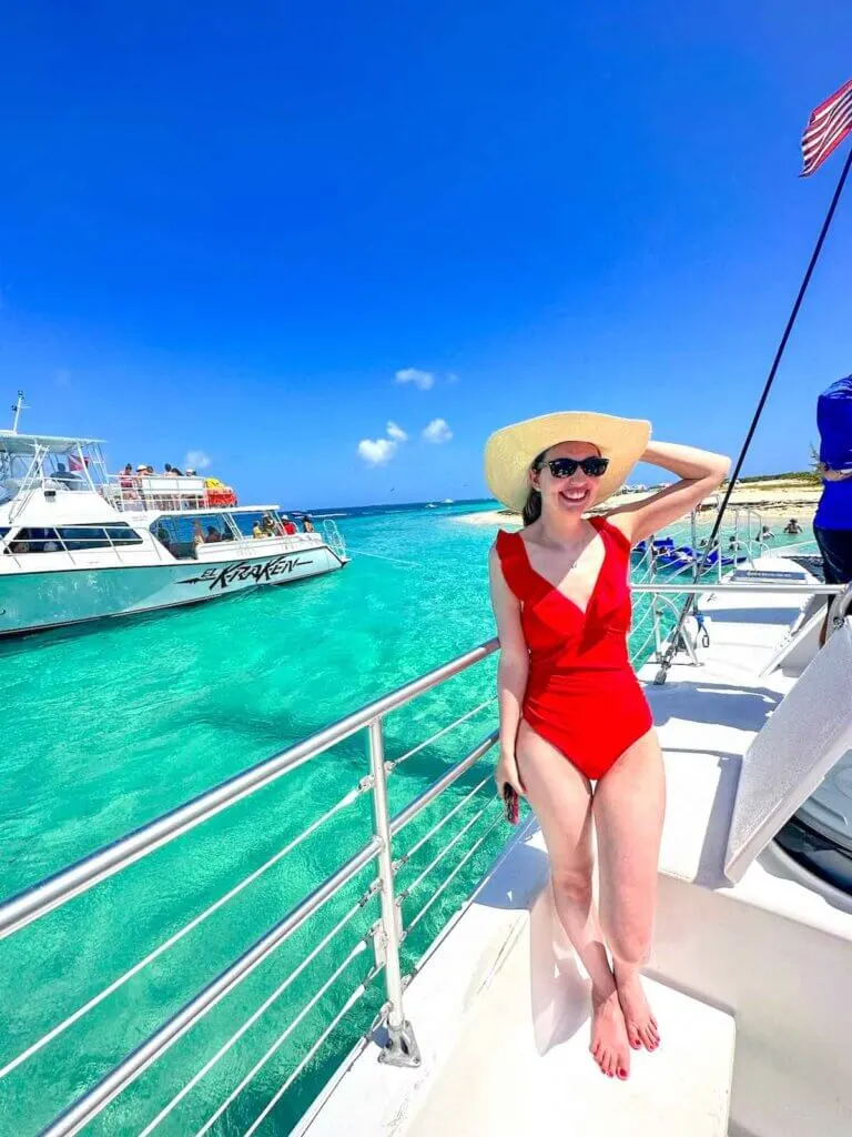 Image of a woman in a red swimsuit on a boat at Icacos Cay in Puerto Rico
