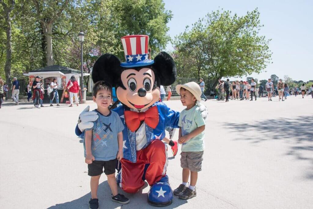 Image of two kids with a fake Mickey Mouse in Madrid