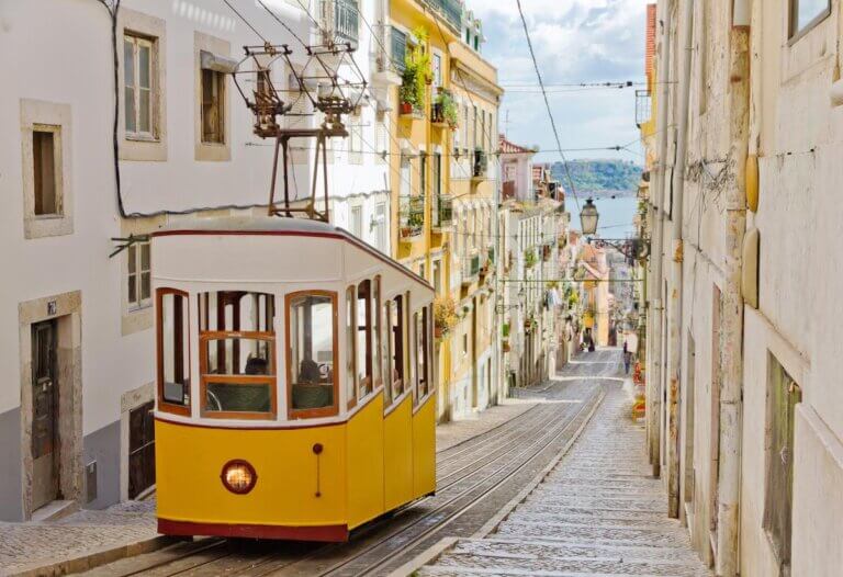 Check out these essential Portugal travel tips by top family travel blog Marcie in Mommyland. Image of Lisbon's Gloria funicular classified as a national monument opened 1885 located on the west side of the Avenida da Liberdade connects downtown withBairro Alto.
