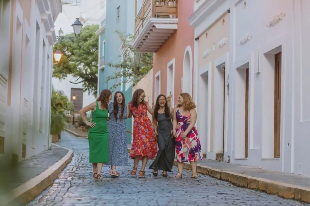 Image of 5 women walking down a cobblestone street in Old San Juan Puerto Rico