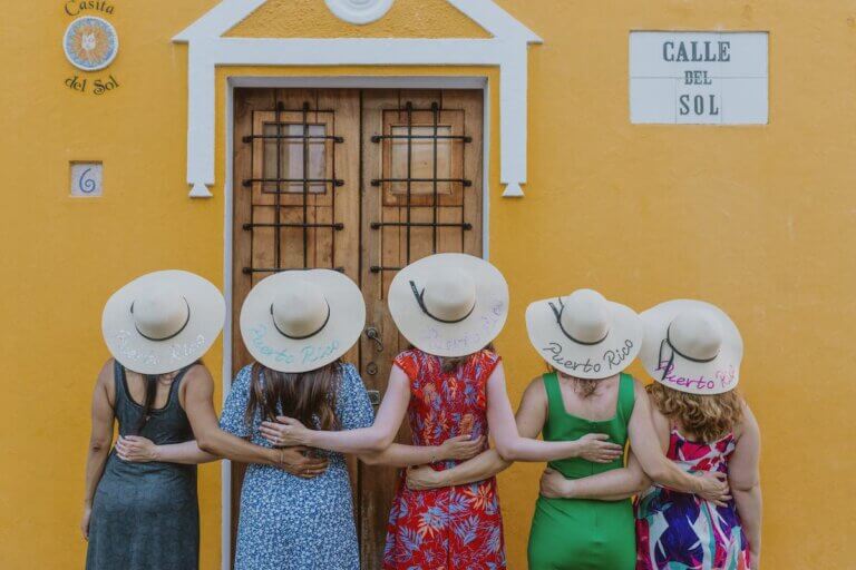 Check out this guide to finding a Puerto Rico photographer on your next vacation. Image of 5 women wearing straw hats in Puerto Rico