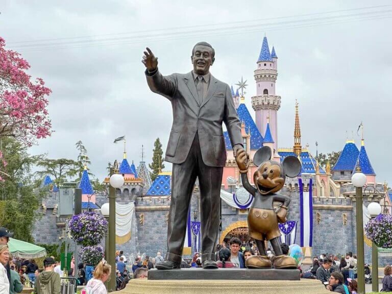 Find out what you need to know before your first trip to Disneyland with tips from top Disney blog Marcie in Mommyland. Image of the Walt Disney and Mickey Mouse statue at Disneyland