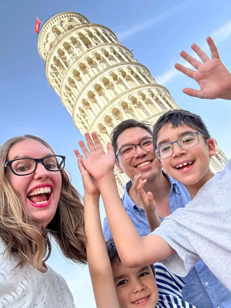 Image of a family selfie at the Leaning Tower of Pisa in Italy