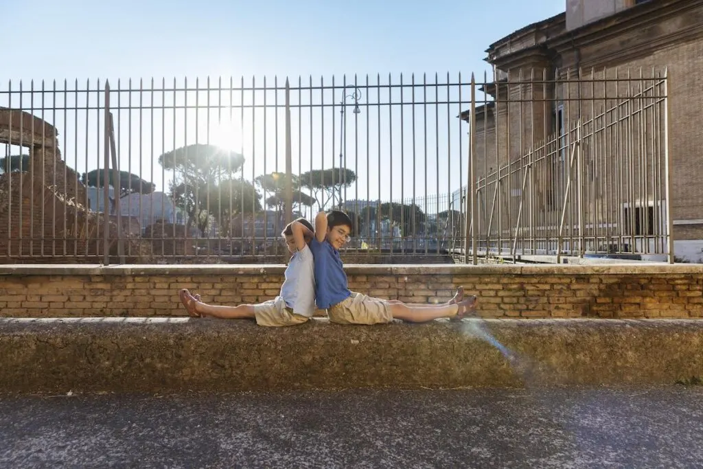 Image of two boys on a ledge in Rome