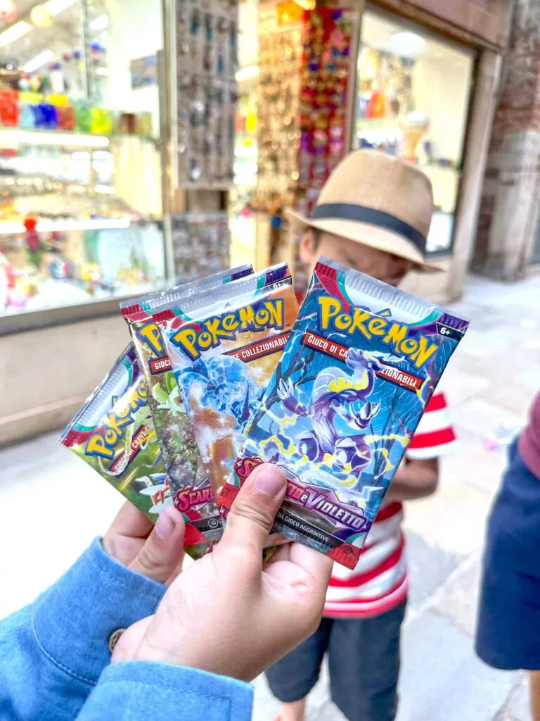 Image of 4 packs of Italian Pokemon cards