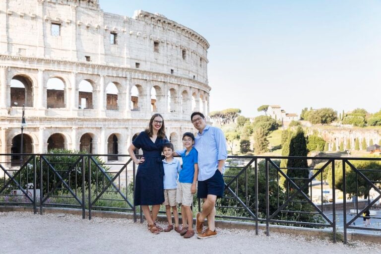 Find out how to spend 10 days in Italy with kids with tips by top family travel blog Marcie in Mommyland. Image of a family of four in front of the Colosseum in Rome.