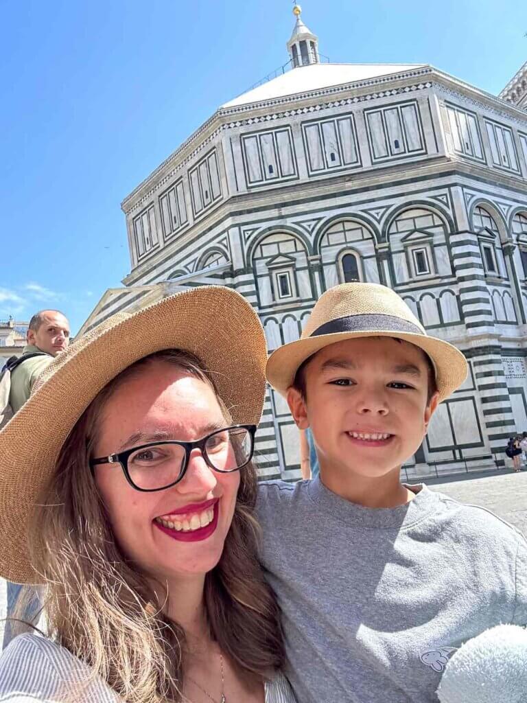 Image of a mom and son in front of the baptistery near the Duomo in Florence Italy