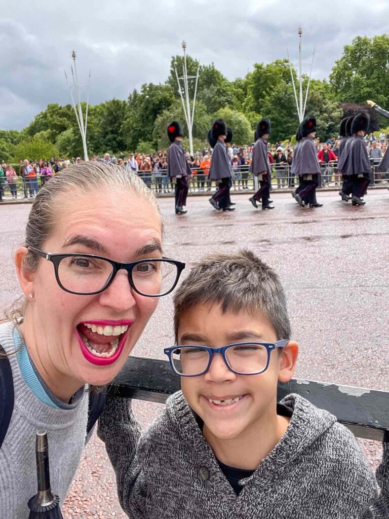 Image of a mom and boy in front of the Changing of the Guard at Buckingham Palace