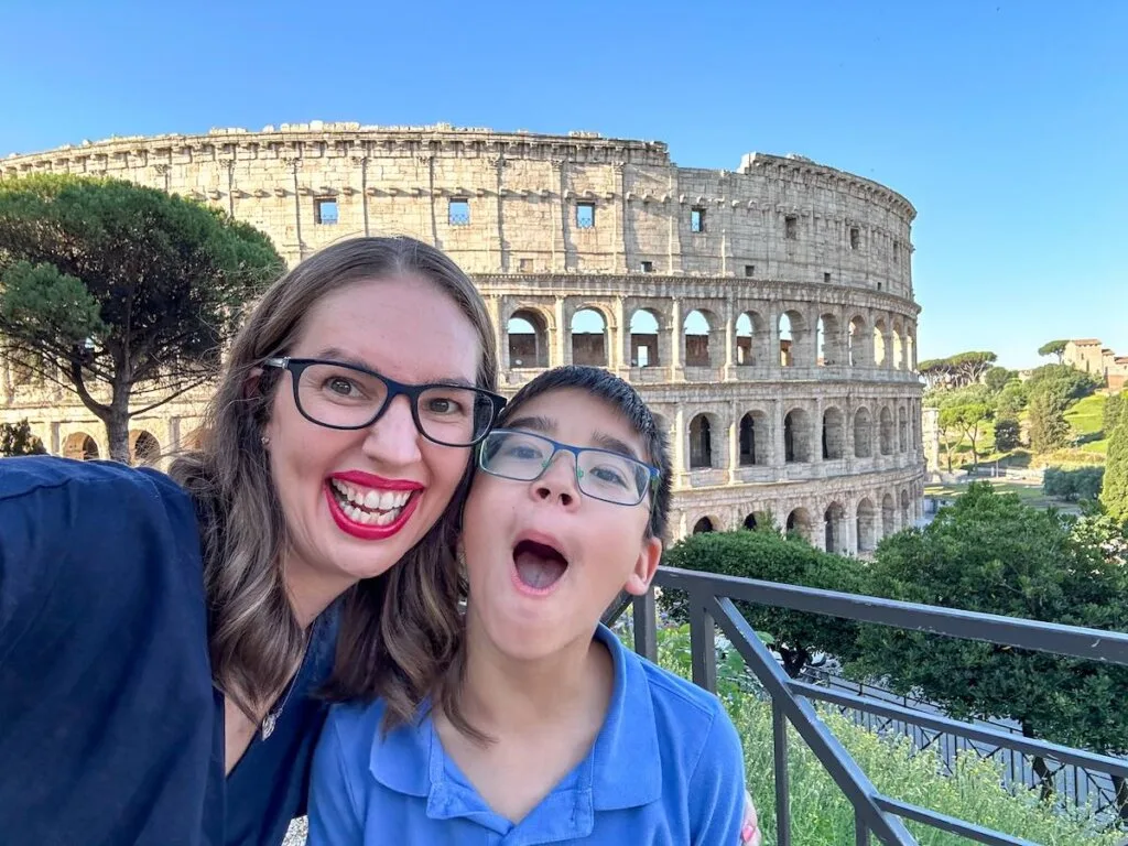 Image of a mom and son in front of the Colosseum in Rome