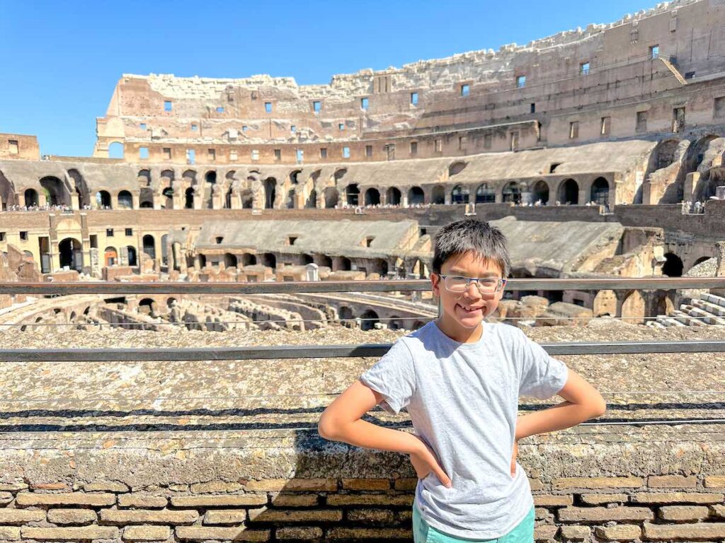 Image of a boy at the Colosseum in Rome Italy