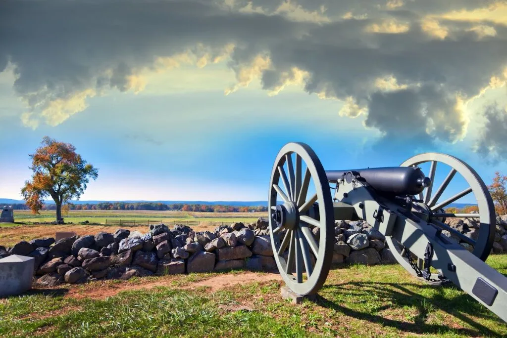 Image of Civil war canon behind a stone wall on the Gettysburg battlefield in Autumn near sunset