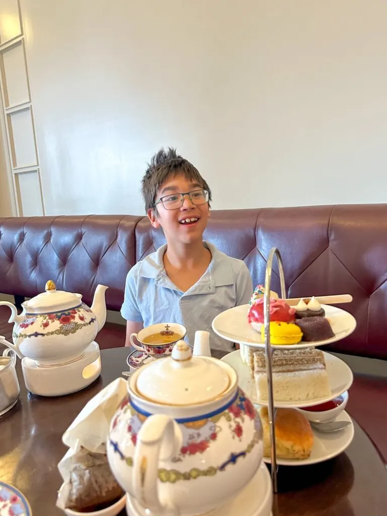 Image of a boy at high tea at the Fairmont empress Hotel in Victoria BC