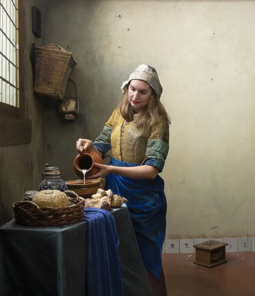 Image of a woman recreating The Milkmaid by Vermeer as part of the Milkmaid Project in Amsterdam