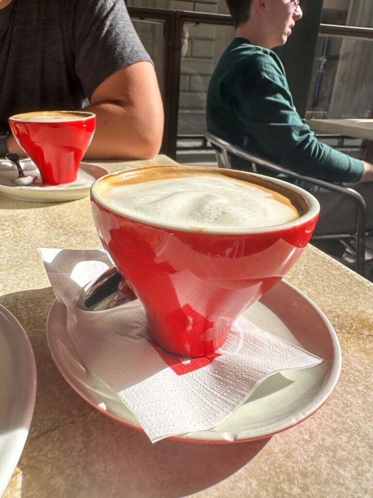 Image of a red cup of coffee at Robiglio bakery in Florence Italy
