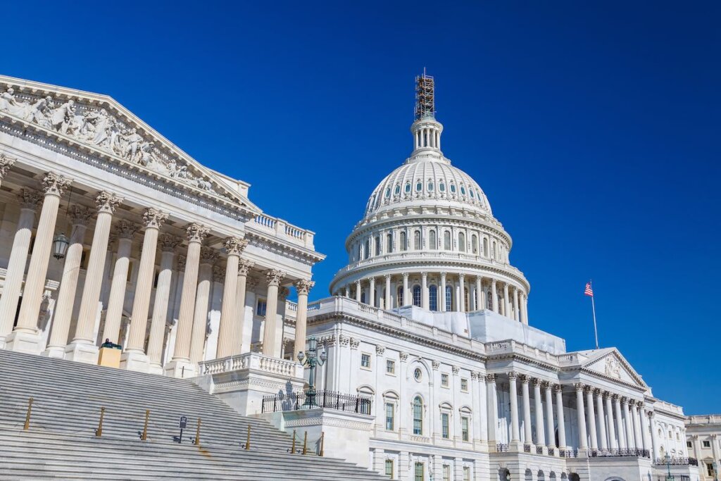 Image of US Capitol over blue sky, Washington DC