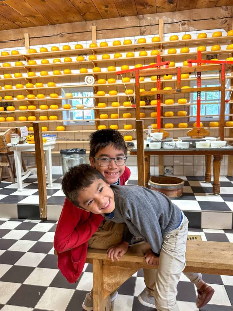 Image of two boys at the cheese factory in Zaanse Schans Netherlands