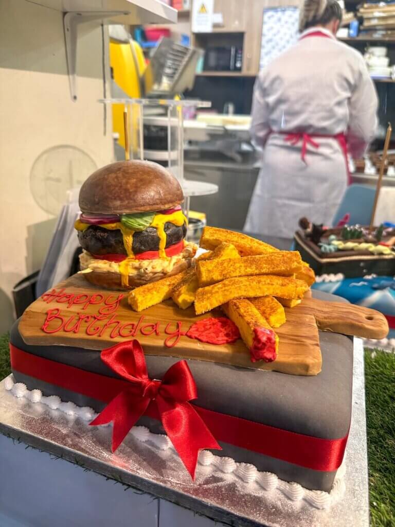 Image of a cake that looks like a burger and fries at the Covered Market in Oxford England